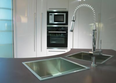 modern metallic sink with graceful tap on the super-modern kitchen