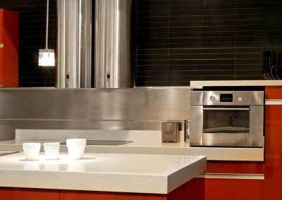Modern kitchen with metallic oven and ventilation