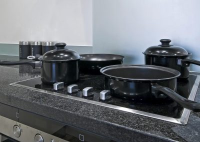 four ring induction electric hob wit pan and pots