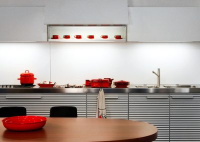 Contemporary silver kitchen interior with wooden table