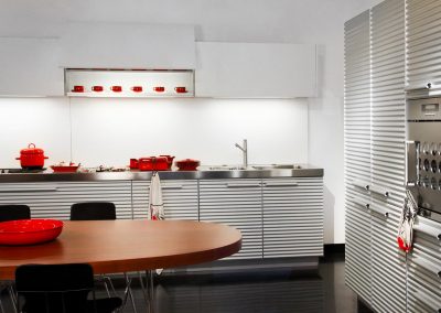 Kitchen interior with modern appliances and wooden table