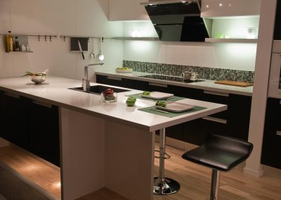 Modern design trend kitchen with black wood elements and metal
