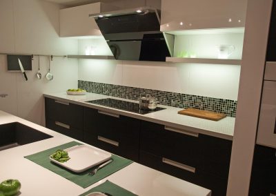 Modern design trendy kitchen with black wood elements, metal and glass