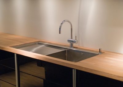 Details of modern design trendy  kitchen sink with water tap faucet
